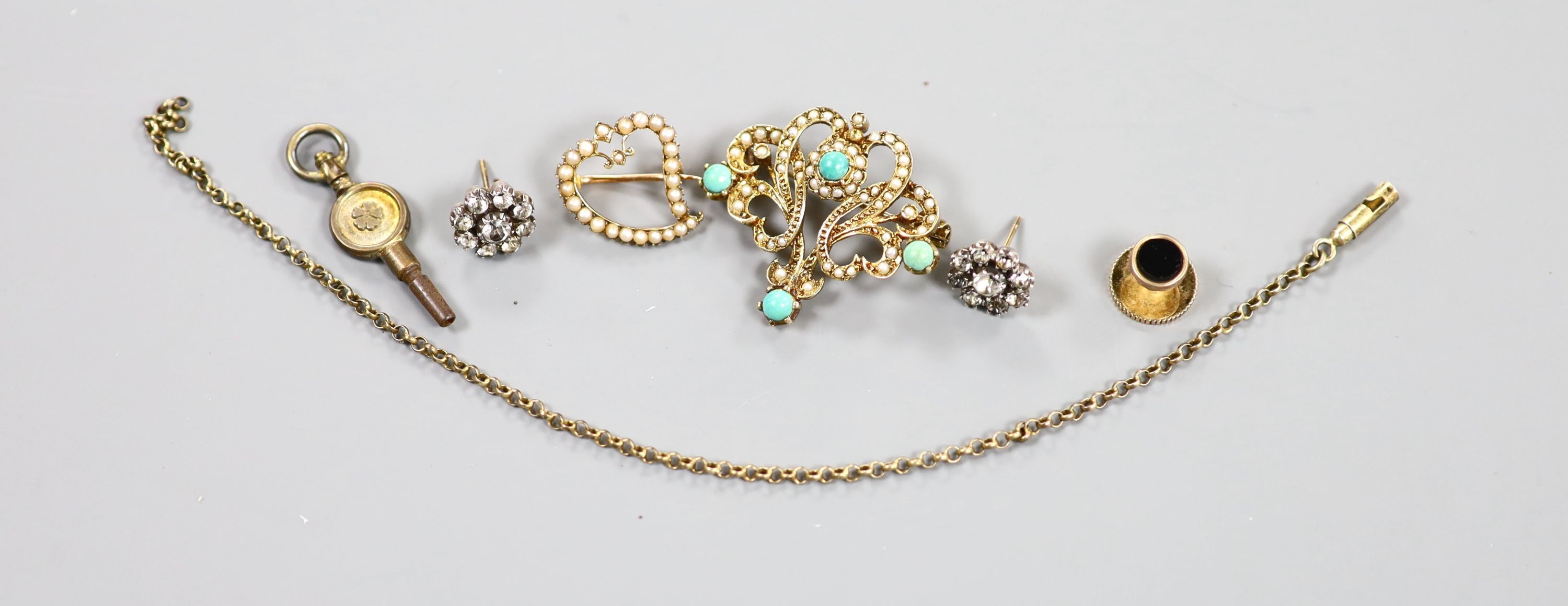 An Edwardian 15ct and seed pearl set open work heart brooch, 18mm, gross 2.1 grams, a modern 9ct gold, seed pearl and faux turquoise set scroll brooch, 32mm, gross 6.2 grams and five other items including a watch key and